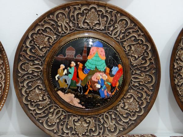 A carved and painted plate